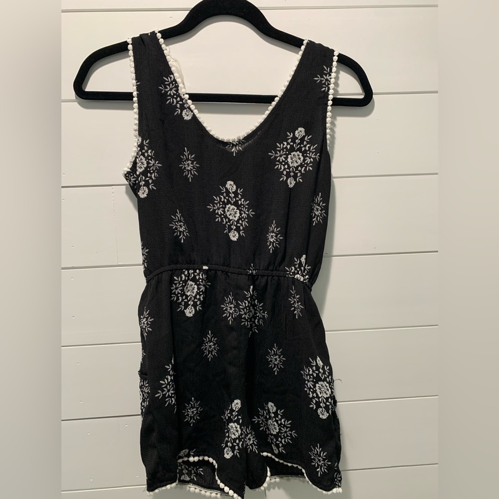Paper Doll, Girls size 12 Romper with white flowers and white trim accent.
